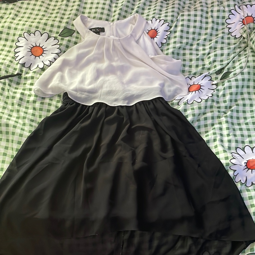 Dress waist line is detailed with textured circles